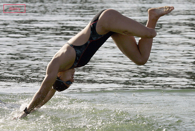 Swimmer jumping in the pool
