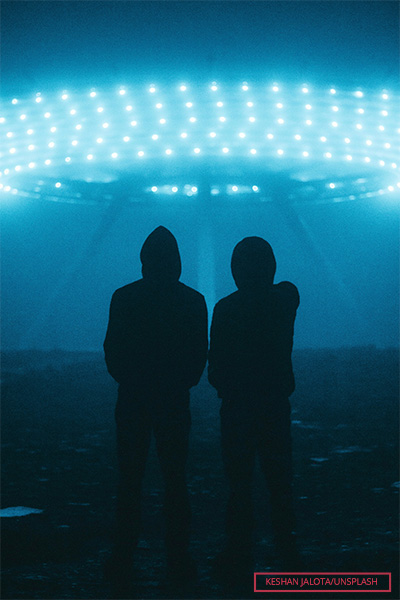 Boys standing in front of a UFO