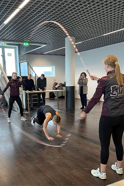 Lisa jumping rope as her friends swing for her