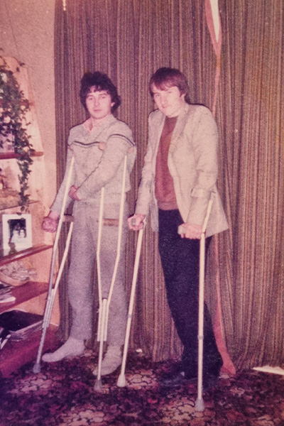 Liam on crutches in 1984, pictured with his friend Tony