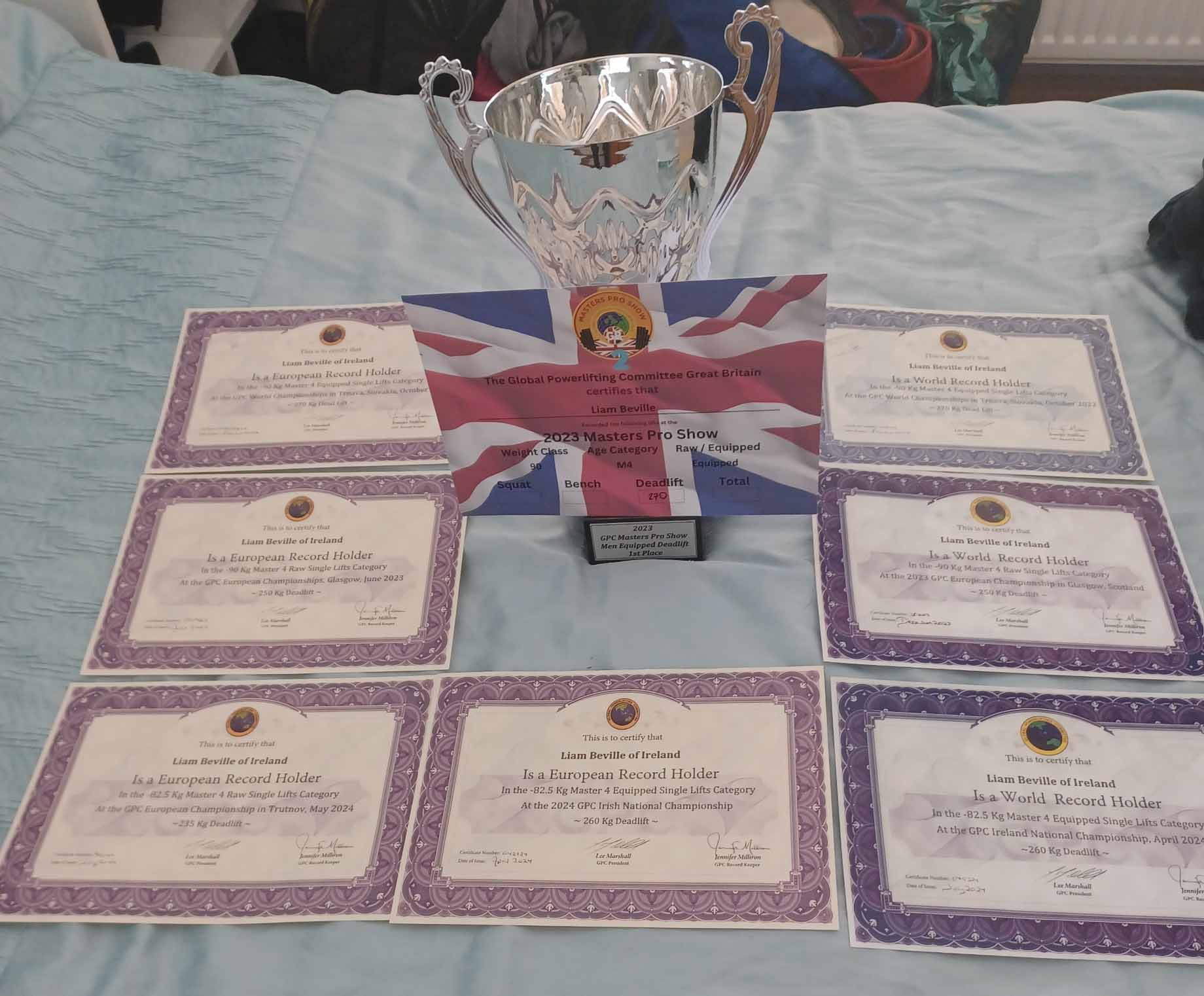 Liam's trophies and certificates