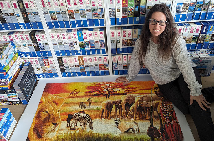 Liza with a completed puzzle