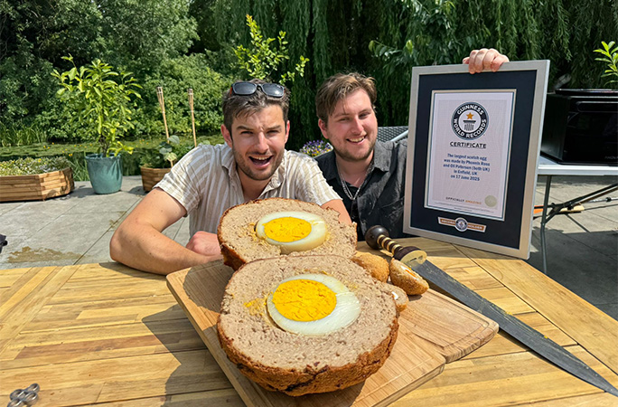 Oli and Phoenix with their certificate