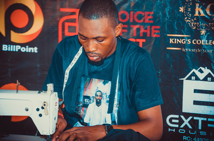 Samuel at the sewing machine