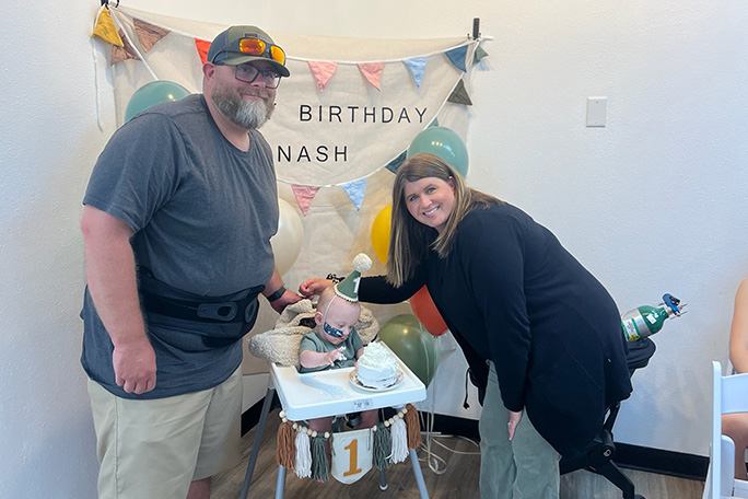 Nash Keen, most premature baby, at first birthday party with mom and dad Mollie and Randall