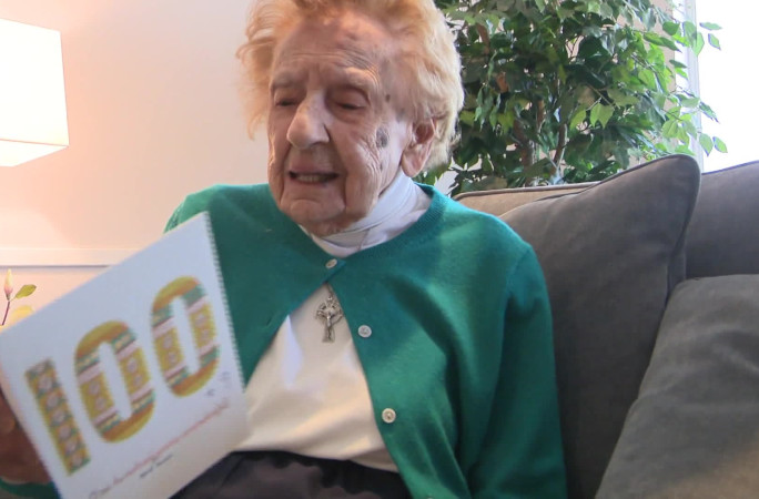 Francis holding her 100th birthday card