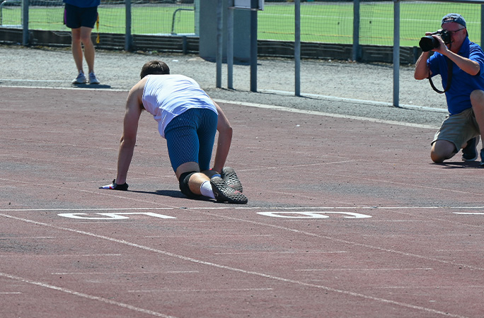 Tom crossing the finish line