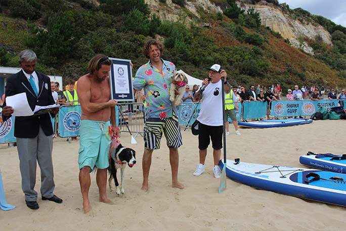 co-winners of the fastest 50 m paddleboarding by a human-dog pair