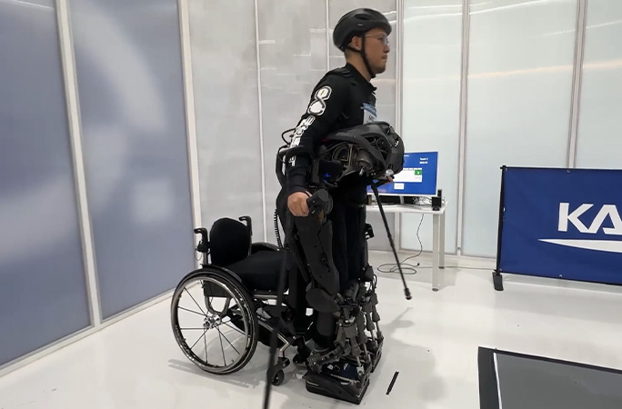 someone standing up in an exoskeleton