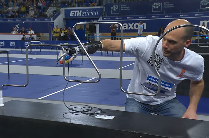 man with bionic arm doing a challenge