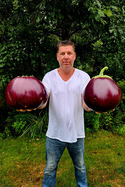 erik-gunstrom-holding-two-record-breaking-heaviest-aubergines-eggplants