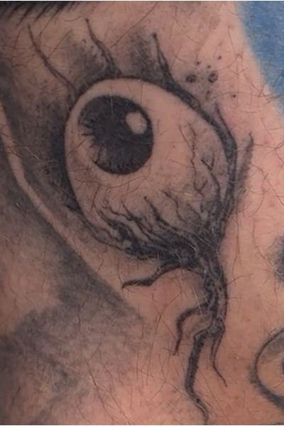 A close up of an eyeball on Chad's leg