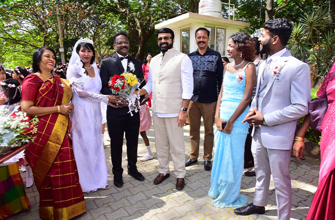 Second and third from left is bride and groom Selvi and Suresh and far right is their children Angelina and Roshan