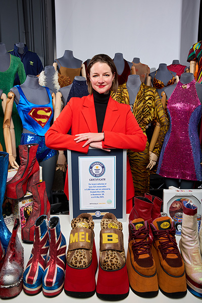 Liz showing her collection and smiling at camera