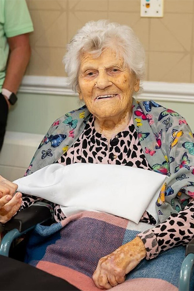 Ethel sitting in a chair
