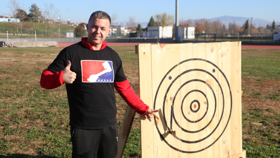 Osman with his axe in the target