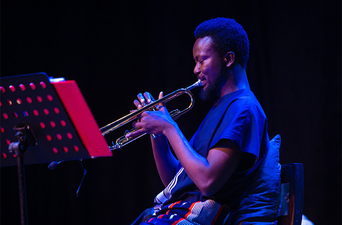 Joshua playing the trumpet
