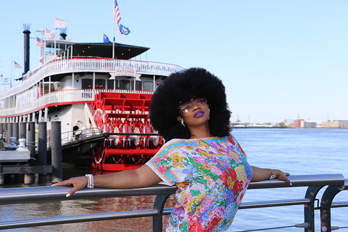 Aevin standing in front of paddle steamer in New Orleans