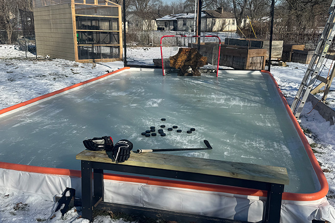 babich family ice rink beneath the sunflower structure in winter