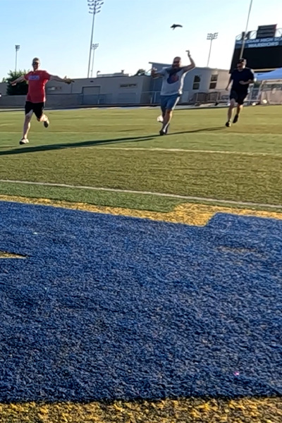 men running across the field