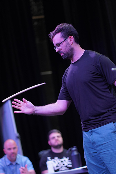 Eric flipping a drumstick