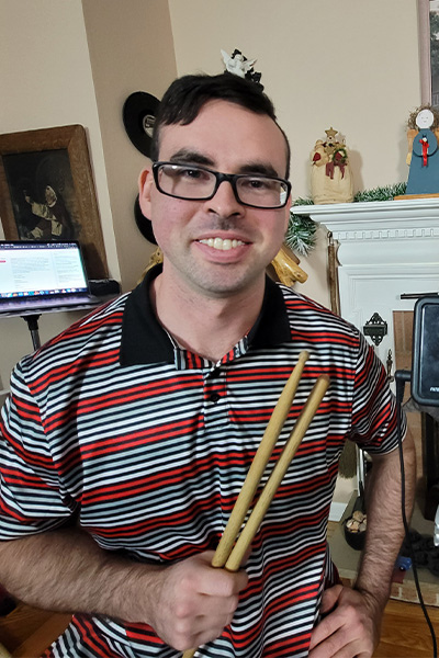Eric drumming with his sticks