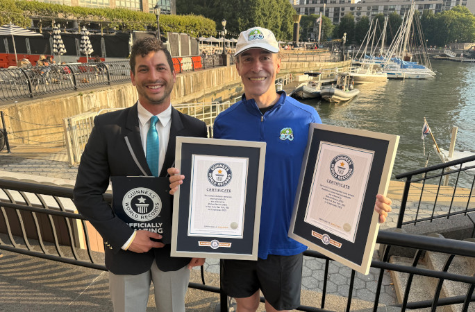 Michael holding his new certificates