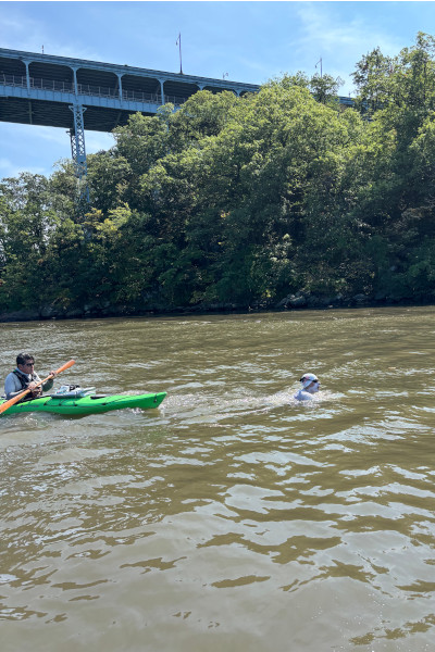 Michael swimming next to nature