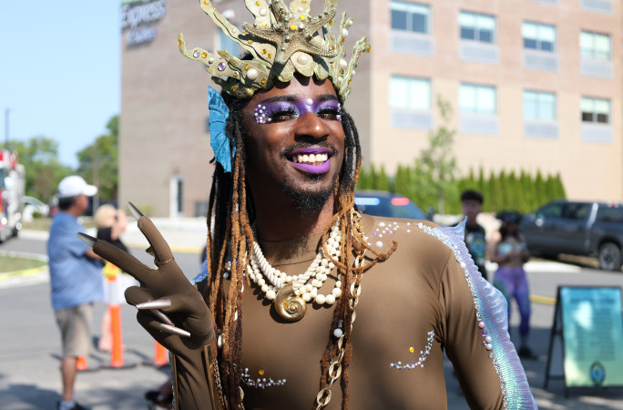 Merperson giving a peace sign