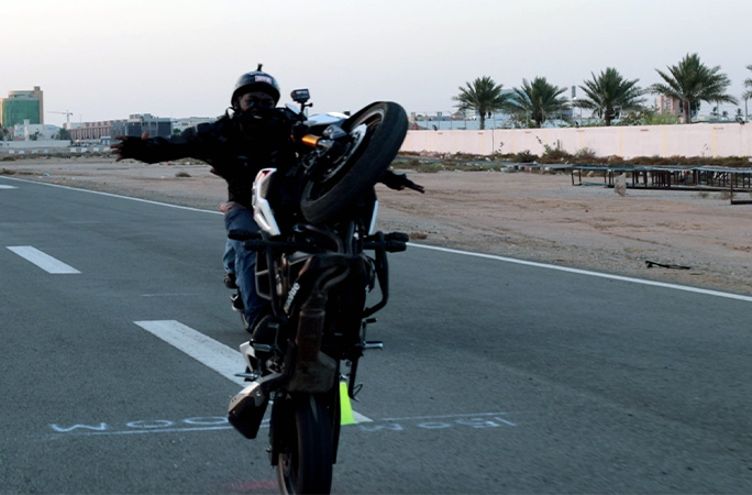 Ahmed holding the bike vertical