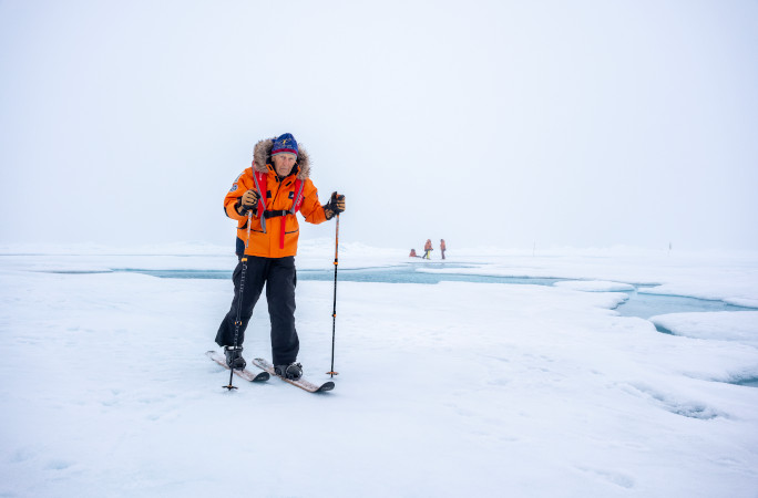 Dick skiing across the ice