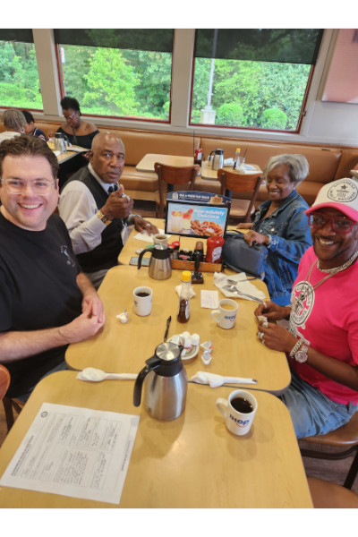 Rex and his loved ones celebrating at breakfast