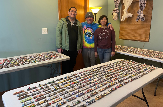 Sonny and his loved ones with his mini skateboard collection