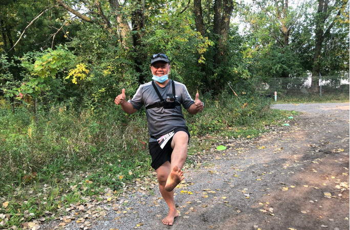 Running barefoot on a forest path