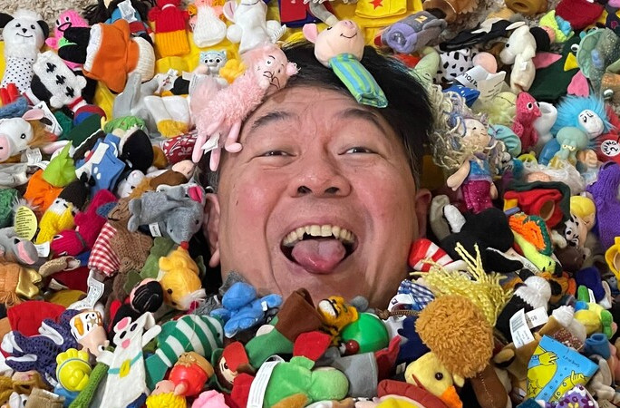 Sonny surrounded by finger puppets