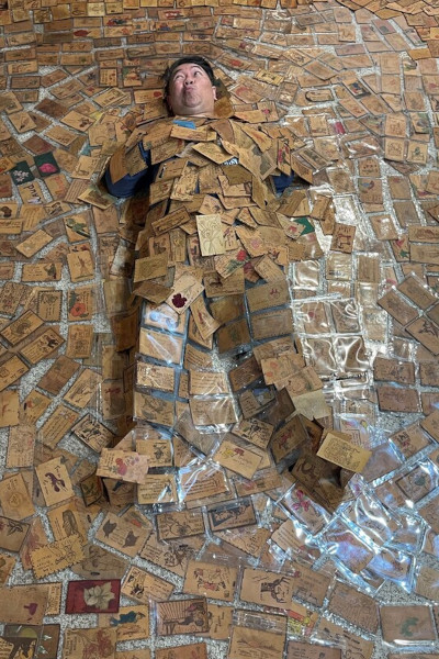 Sonny surrounded by leather postcards