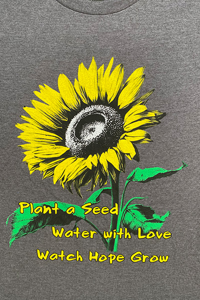 t-shirt-inscribed-with-sunflower-motif-and-the-babich-family-motto