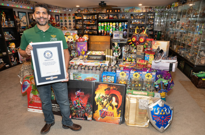 Coz smiling in front of his collection