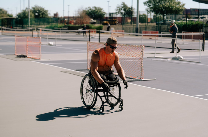 Mike pushing his chair during the day