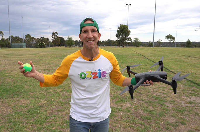 Ozzie holding the ball and drone