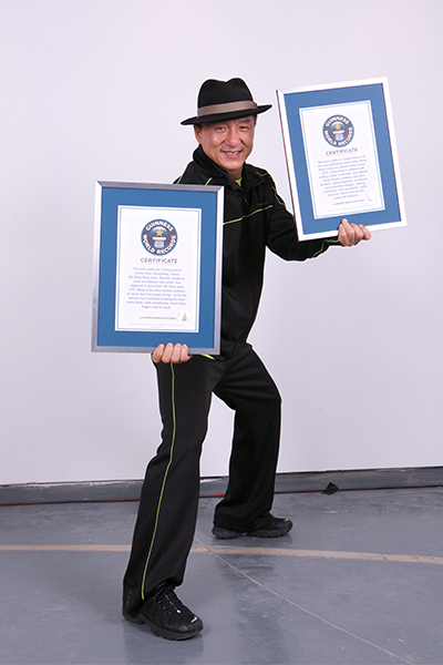 Jackie Chan with GWR certificates