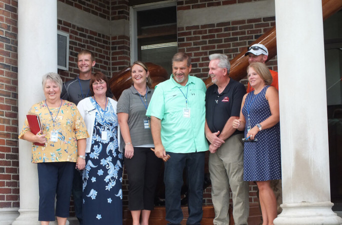 Jim with the largest gavel and other community members