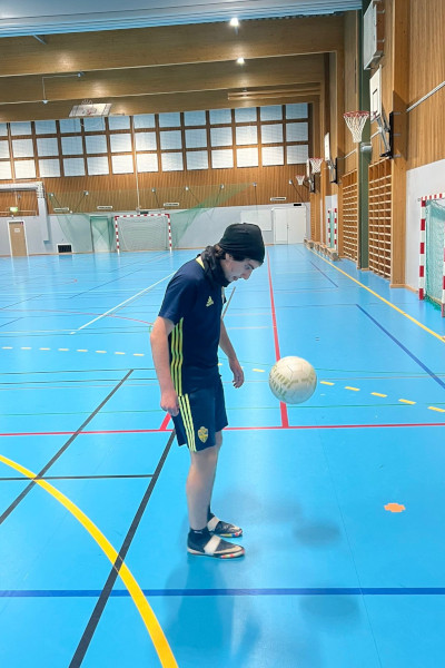 Daniel staring at the ball while its midair