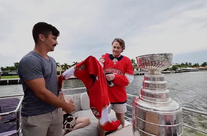 Dakota putting on a player jersey