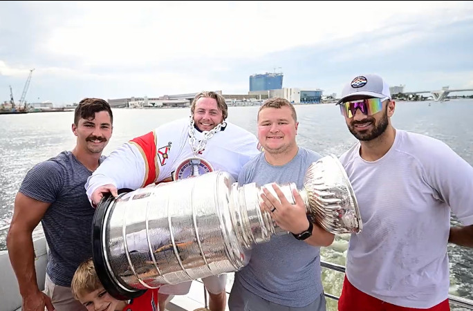 Dakota and his friends holding the Stanley Cup