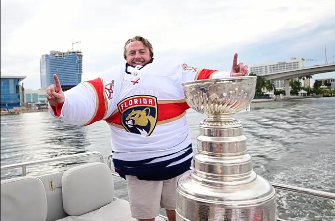 Dakota with his goalie kit and the Stanley Cup