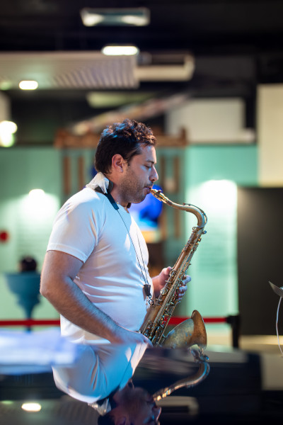 Elvis playing his saxophone