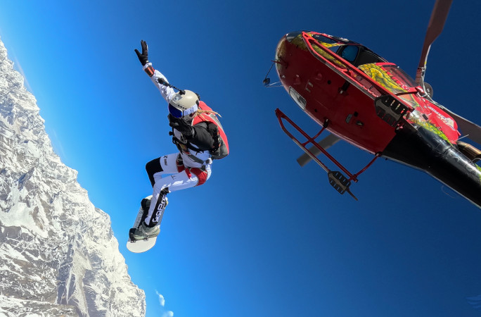 Olga jumping out of the helicopter