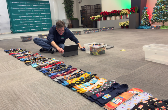 Jim putting the socks in his spreadsheet