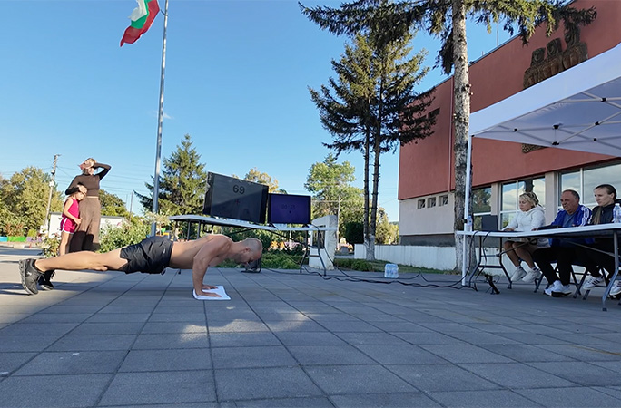 Michael doing push ups with witnesses watching